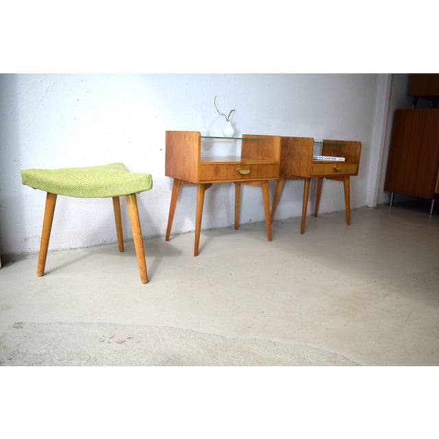 These are two beautifully designed mid-century modern nightstands by Helmut Magg for WK Möbel. The nightstands feature a...