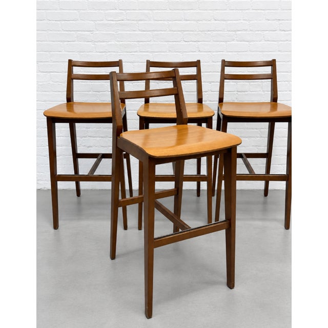 West Elm bar height stools made for use at Starbucks with warm walnut coloring, clean lines and a simple yet extremely...