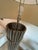 Pair of Slim Chrome Column Floor Lamps. The base is a hollow combination of tubular chrome finished rods that is connected...