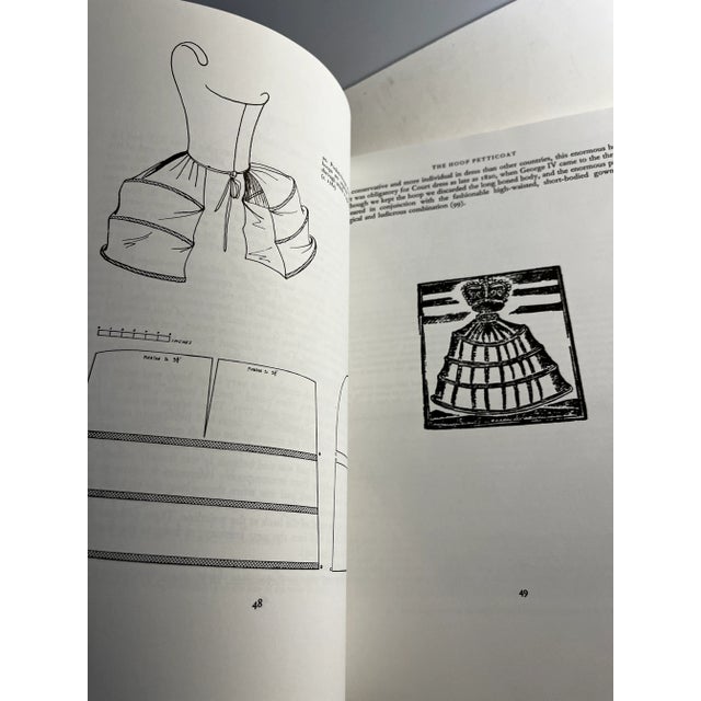 Corsets and Crinolines, 1991. Routledge/Theatre Arts Books, New York. Oversized softcover illustrated throughout in black...