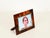 Stunning Mid-Century rectangular photo frame entirely crafted in vibrant tortoiseshell-effect acrylic and gilt brass. This...