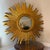 Make a striking statement in any room with this brilliant vintage sunburst wall mirror. Featuring a rich, textured...