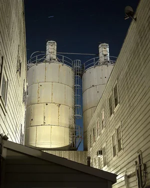 Contemporary Night Photograph "Twin Tanks" by John Vias
