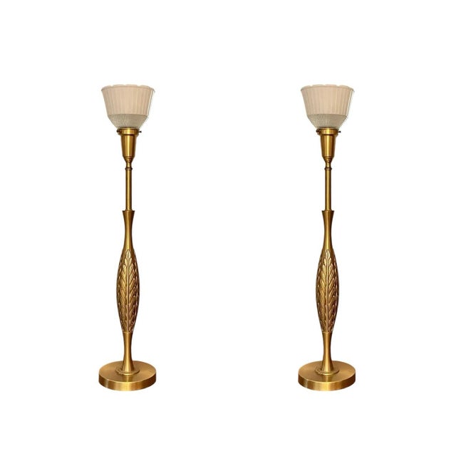 This swanky pair of mid-century brass lamps by Rembrandt feature slender bases of spun brass and finely cast acanthus...