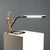 The 'Tubino' table lamp, designed by brothers Achille and Pier Giacomo Castiglioni for Flos in the 1960s and 1970s, is an...