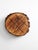 A vintage wood slice tic tac toe board with a warm, rustic presence. The natural bark edge and carved grid give it an...