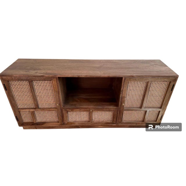 This Coastal Boho media console is 5 feet long and narrow, crafted from solid teak wood with a natural wood finish,...