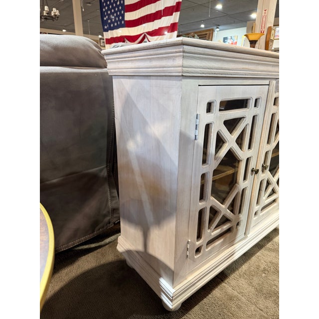 This refined One Allium Way accent cabinet blends classic craftsmanship with soft, timeless elegance. Finished in a gently...