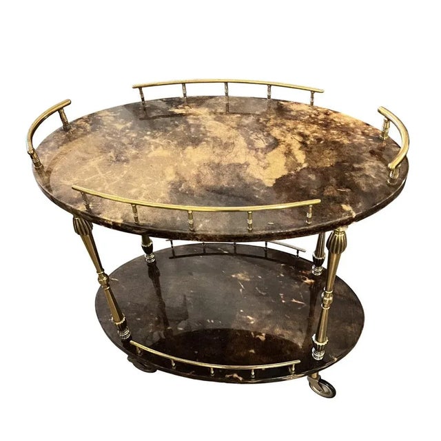 This wonderful lacquered goatskin and brass Mid-Century drinks trolley was designed in Italy by Aldo Tura. His use of...