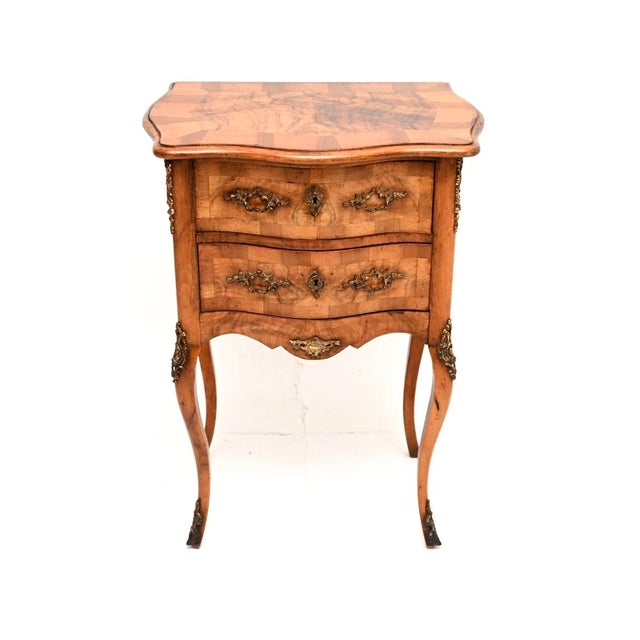 A gorgeous little antique French burr walnut chest of drawers / side table. This was made in France, it dates from around...
