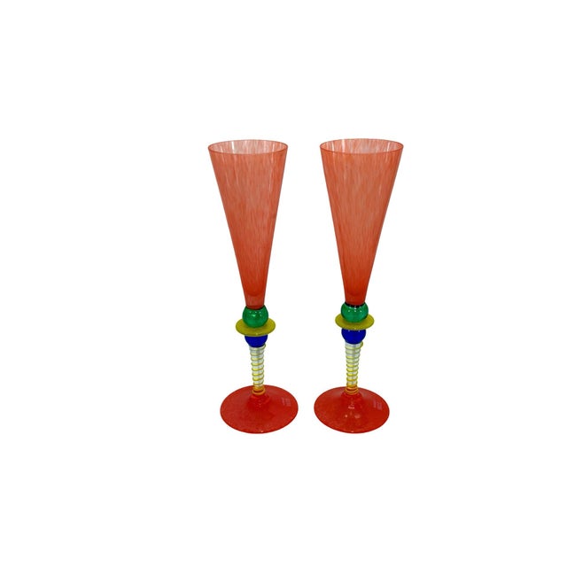 These rare handcrafted champagne flutes offer a bold multicolor design, combining elegance with artistic flair, ideal for...