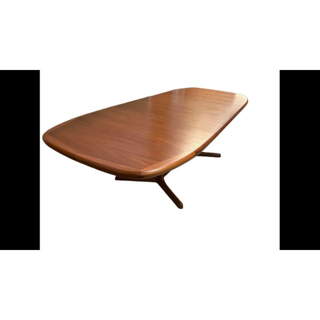 Dyrlund Oval Teak Dining Table made in Denmark. Comes with two leaves. Excellent restored condition. Professionally...
