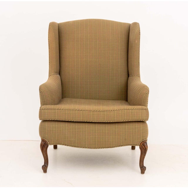 Queen Anne Style Beige Plaid Upholstered Wingback Arm Chair, on four cabriole mahogany legs. 39" H x 29" W x 26" D; seat:...