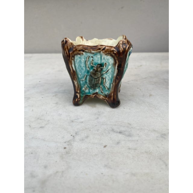 Small French Majolica cache pot attributed to Onnaing, Circa 1890. Decorated with butterfly,insect and leaves. H / 2.7"