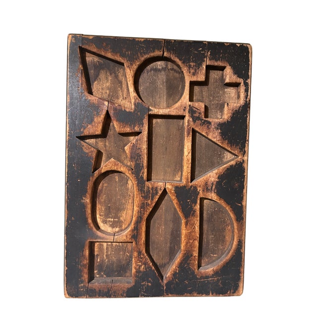 Child's antique puzzle board. c 1890-1900 in original black paint. From the Folk Art collection of Peter Brams, sold at...
