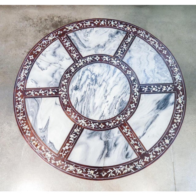 Wooden table carved and inlaid, with marble sections on the top origin china period late 19th century materials wood,...