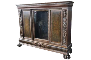 20th Century Renaissance Revival Walnut Carved Figural Knockdown Bookcase Armoire