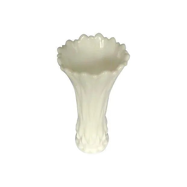 Tall flute-shaped lattice pattern milk glass vase.