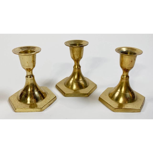 A nod to mid-century style for your table! Set of three MCM solid brass candlesticks with unique hexagonal bases. Short in...