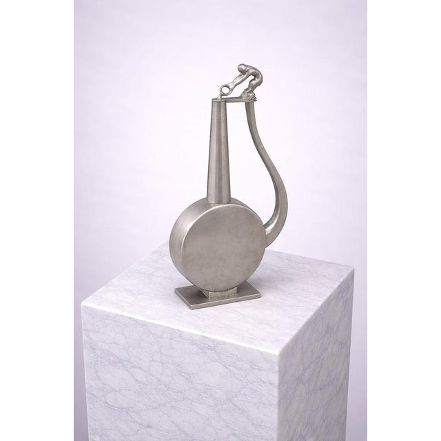 A rare and sculptural art deco pewter vessel produced by gab (guldsmedsaktiebolaget), sweden, and dated 1937. This...