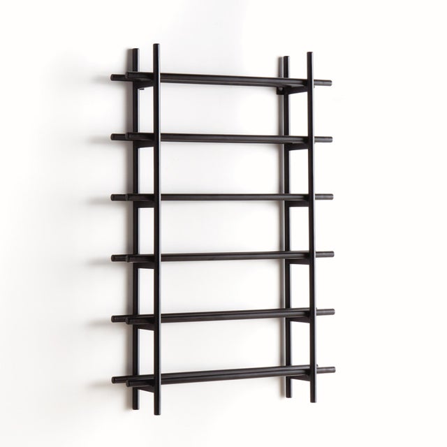 Clean and modern, this handsome wine rack is made of round metal stock. It effortlessly showcases your favorite six...