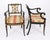 A superb antique set of ten Regency Revival polychrome ebonized and parcel-gilt dining armchairs, dating from the early...