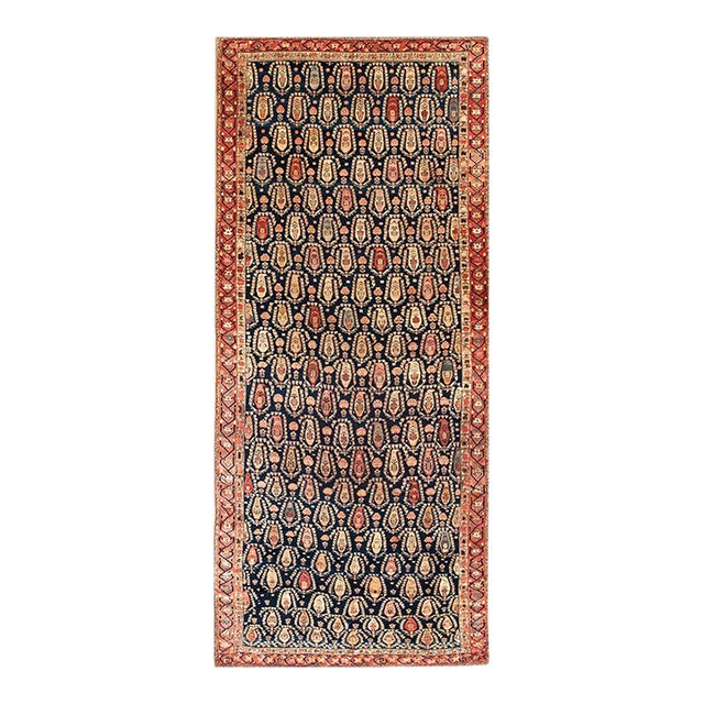 Charming Allover Design With Tinys Flowers on a Navy Background Color Antique Persian Gallery Rug For Sale