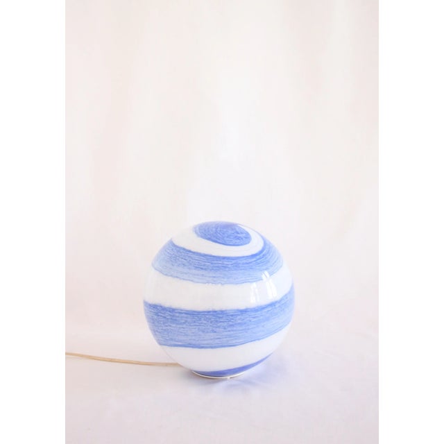 Large glass lamp with a swirl design from the German brand "Wofi Leuchten". The lamp is made of glass and stands on a...