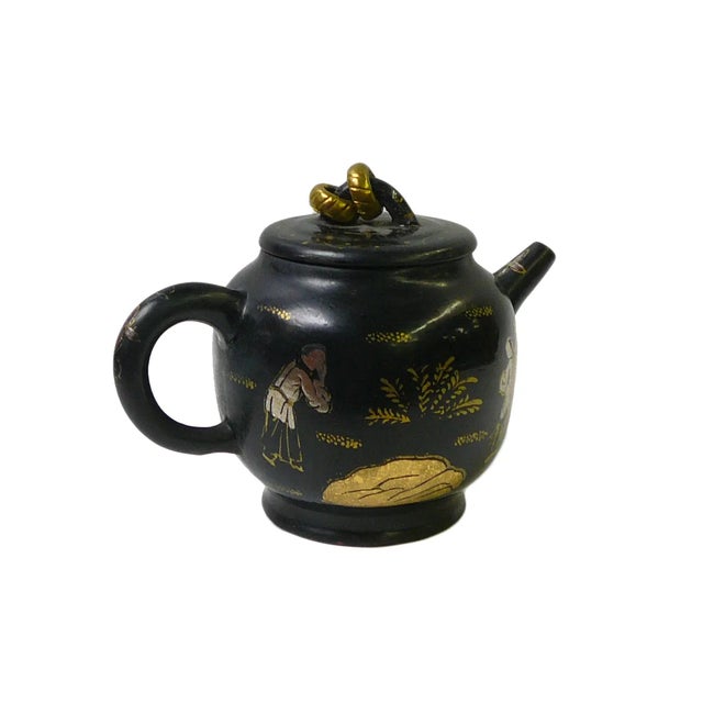 Elevate your tea experience with our Traditional Asian-Inspired Teapot. This elegant piece features a glossy black finish...
