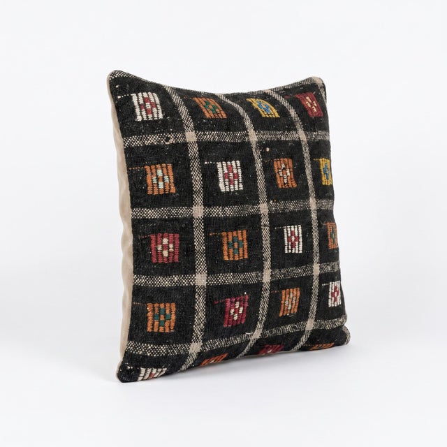 This beautiful 19'' x 20'' pillow cover was made from an authentic Turkish rug. Bright colors of wool adorn the front of...