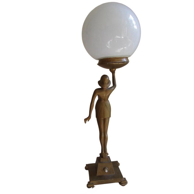 An Art Deco Banksway figural lamp of lady holding a large globe above her head. This lamp is in very good condition and...