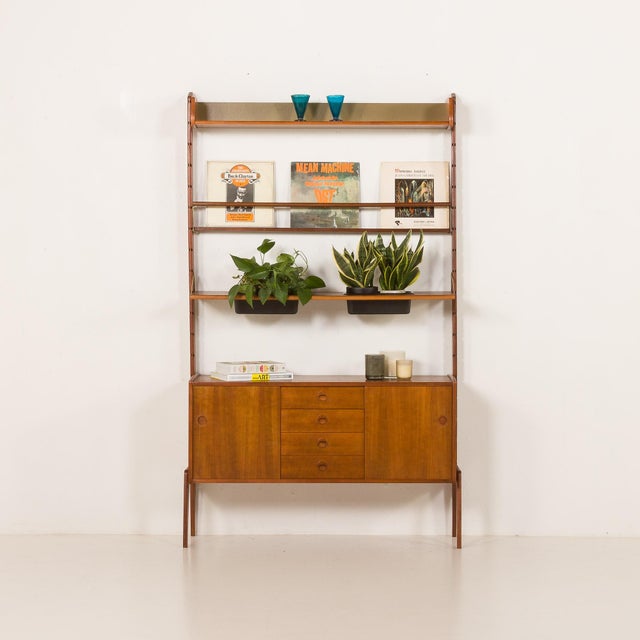 This functional large freestanding wall unit is a true example of scandinavian mid-century design at its best. It is an...