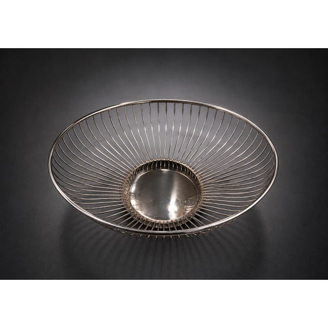 Bring timeless Mid-Century Modern style to your home with this vintage Leonard Silverplate wire fruit basket, crafted in...