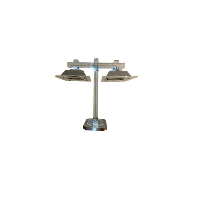 Bring a touch of Hollywood Regency glamour into your space with this stunning vintage 1970s Lucite and Chrome 2-Arm...