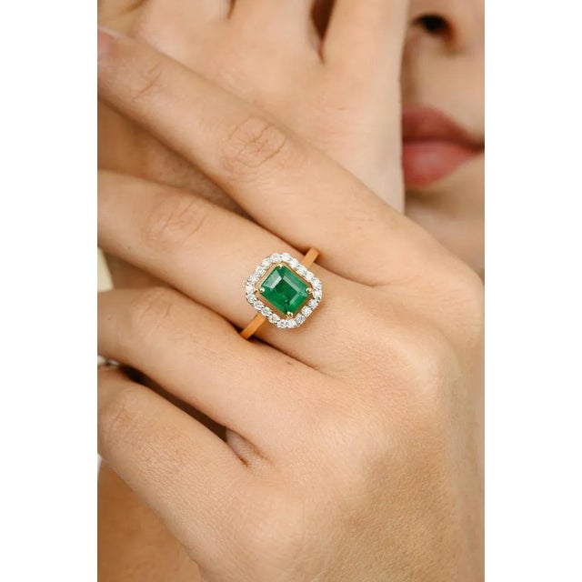 This is part of Chairish’s Fine Jewelry assortment. 1.5 Carat Certified Emerald Halo Diamond Wedding Ring in 18K Gold...