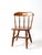 A charming mid-century children's chair in the Early American style, featuring turned spindle supports, turned legs, and a...