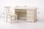 Elegant cream-painted writing desk with solid wood construction, three drawers, and a pull-out keyboard tray, paired with...