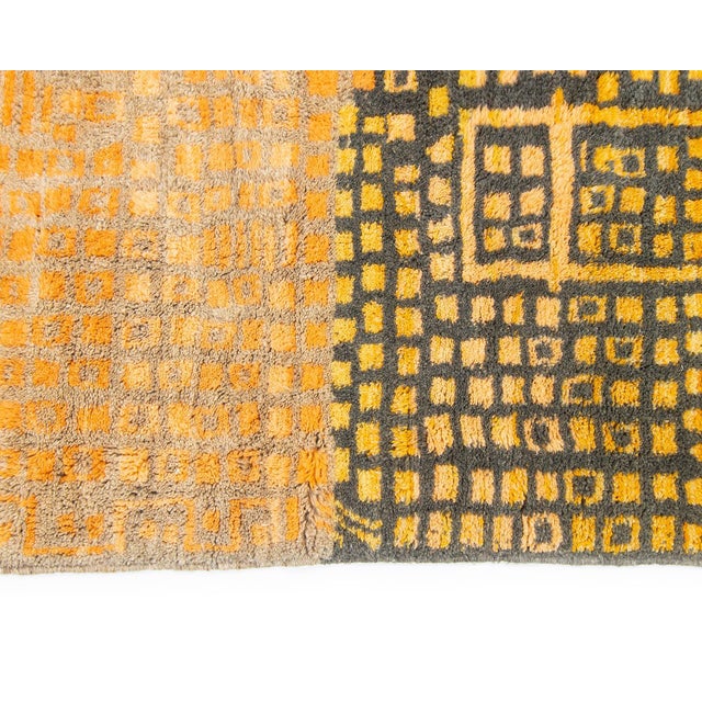 Beautiful wool rug, meticulously hand-knotted, featuring detailed geometric pattern in Charcoal and Mustard shades set...