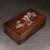 This is a beautifully crafted rectangular wooden box featuring intricate mother-of-pearl (nacre) inlay work on the lid....