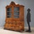 Large Dutch display cabinet in walnut and walnut burl. Floral and butterfly inlays in maple throughout, top with a pair of...