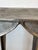 Moroccan style chic cast aluminum end table having textured top.