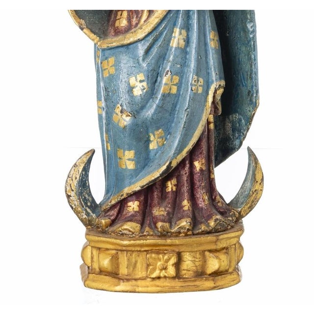 Our lady with the boy jesus indo-portuguese sculpture, !7th century in polychrome, upholstered and gilded wood. The figure...