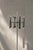 This vintage floor lamp was produced in Italy during the 1960s. It is made of chrome-plated elements mounted on a red...