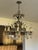 Vintage Brass & Crystal Chandelier with 2-levels of candles. The brass body of fixture has tree branch style detail,...
