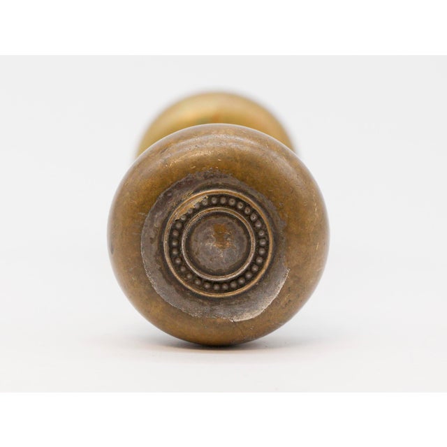Concentric Colonial style door knobs with an antique patina. The manufacturer and date of creation is unknown. Sold as two...