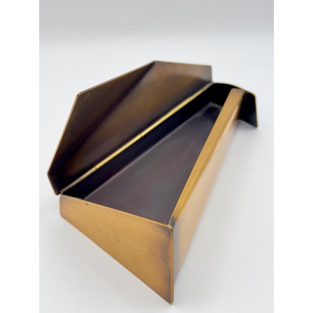 This one-of-a-kind sculptural metal box by artist Ron Hinton, signed and dated 1987, features a dramatic angular lid and...