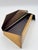 This one-of-a-kind sculptural metal box by artist Ron Hinton, signed and dated 1987, features a dramatic angular lid and...