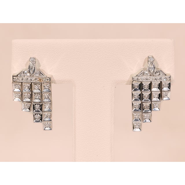 The Somara Elaborate Antique Platinum Diamond Dangler Earrings. These lively antique dangler earrings are crafted in...