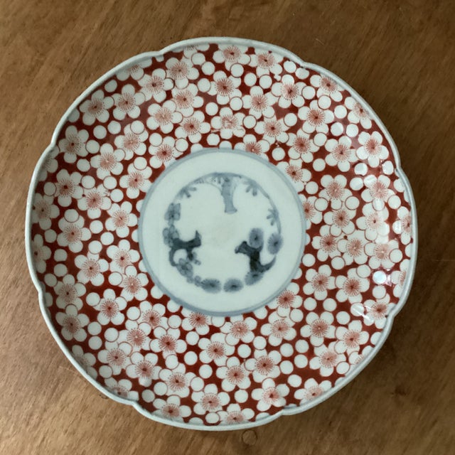 This Antique Imari Scalloped Porcelain Polychrome Plate with Cherry Blossoms Flowers is a vintage original piece...