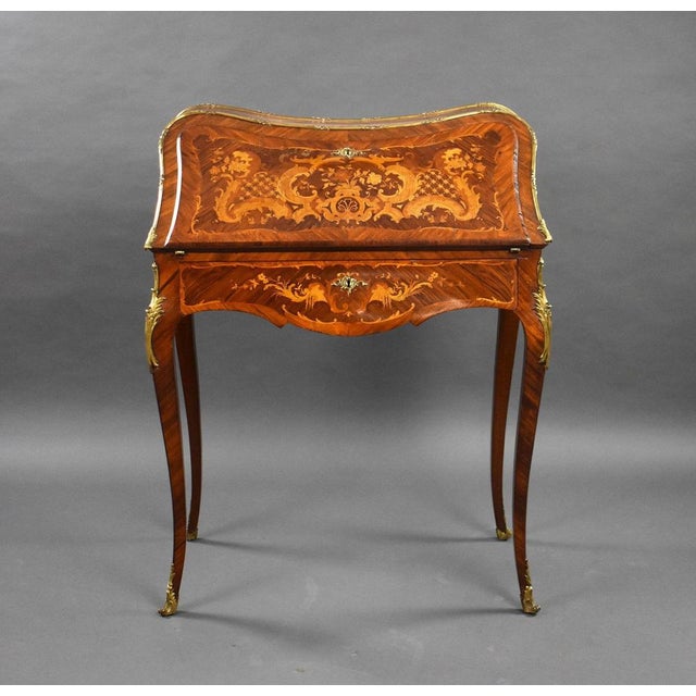 For sale is a good quality 19th century French gilt metal mounted marquetry bombé bureau de dame, in the Louis XV style....